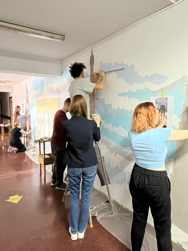 Students creating the mural